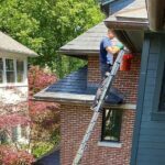 Cleaning Gutters And Pipes From Leaves And Debris